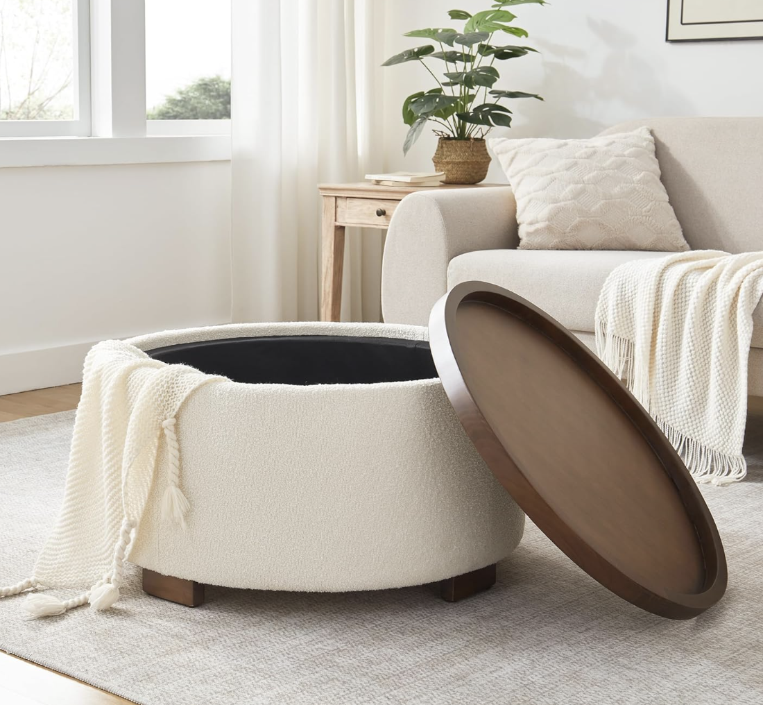Otomana redonda de bouclé beige con tapa de madera y almacenamiento interior