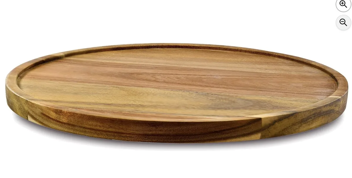 Tabla giratoria ovalada de madera de acacia para servir aperitivos